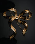 “Christian Dior“ 80’s-90’s CD-embossed ribbon brooch