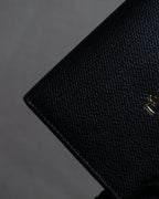 "YVES SAINT LAURENT" Cassandra logo engraved leather bi-fold wallet