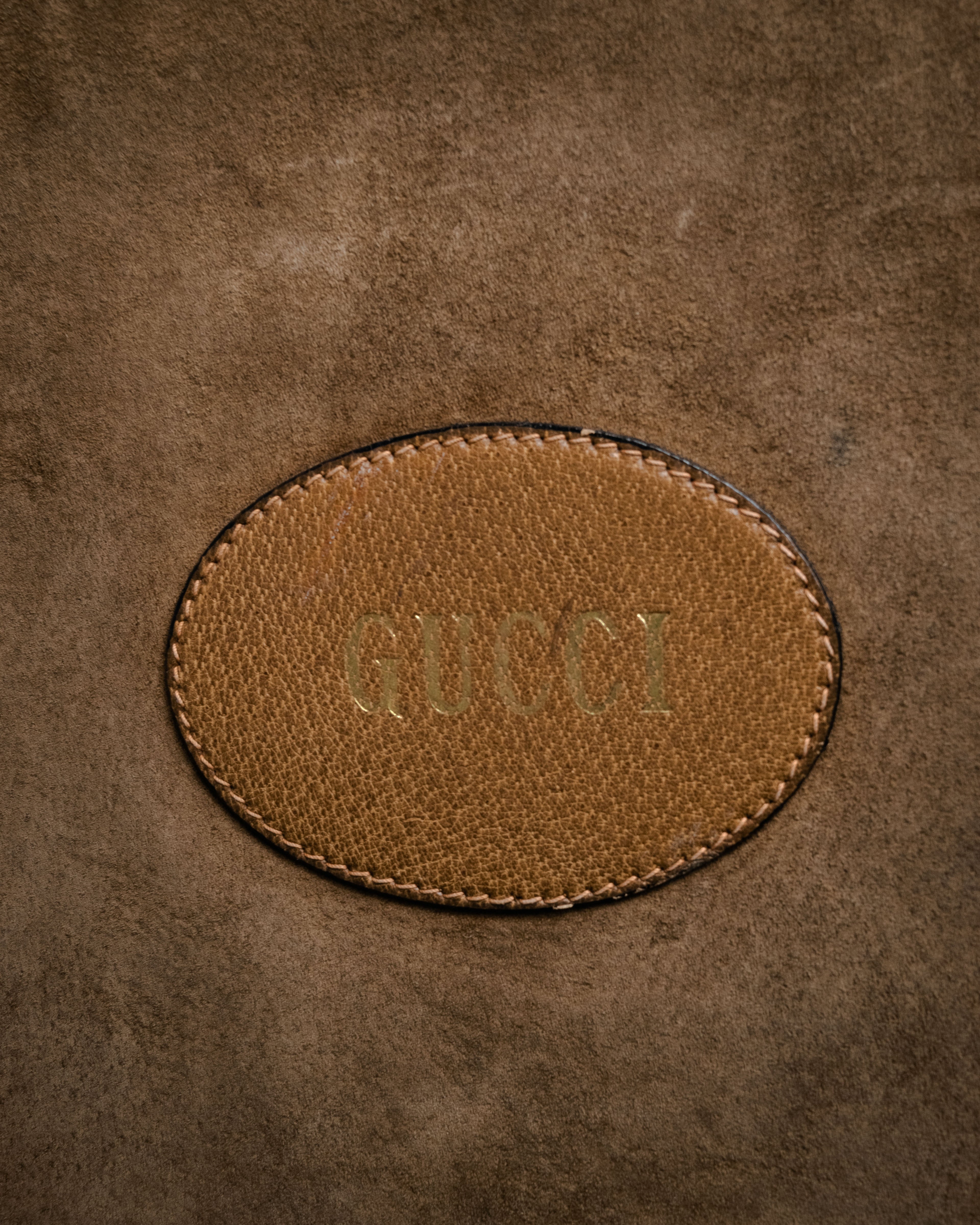 “GUCCI” Late 70’s-early 80’s suede and leather cutout handle bag