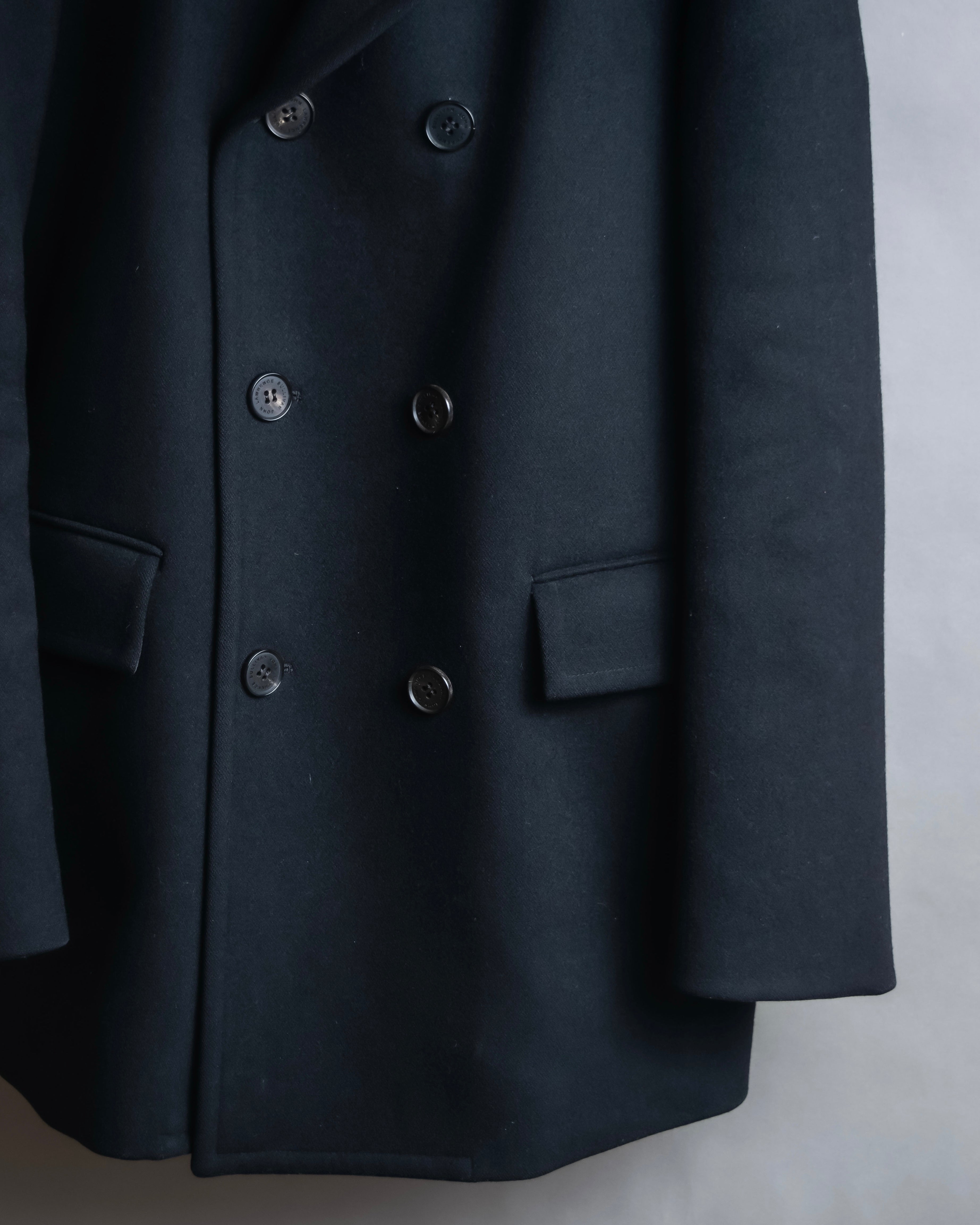 "JOHN LAWRENCE SULLIVAN"
 Large lapel double-breasted mid length coat