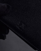 "LOEWE" Logo engraved bi-fold leather wallet