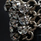 "SERGE THORAVAL" Crystal top chain braided ring