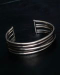 “PHILIPPE AUDIBERT” Crossed 5 line silver bangle
