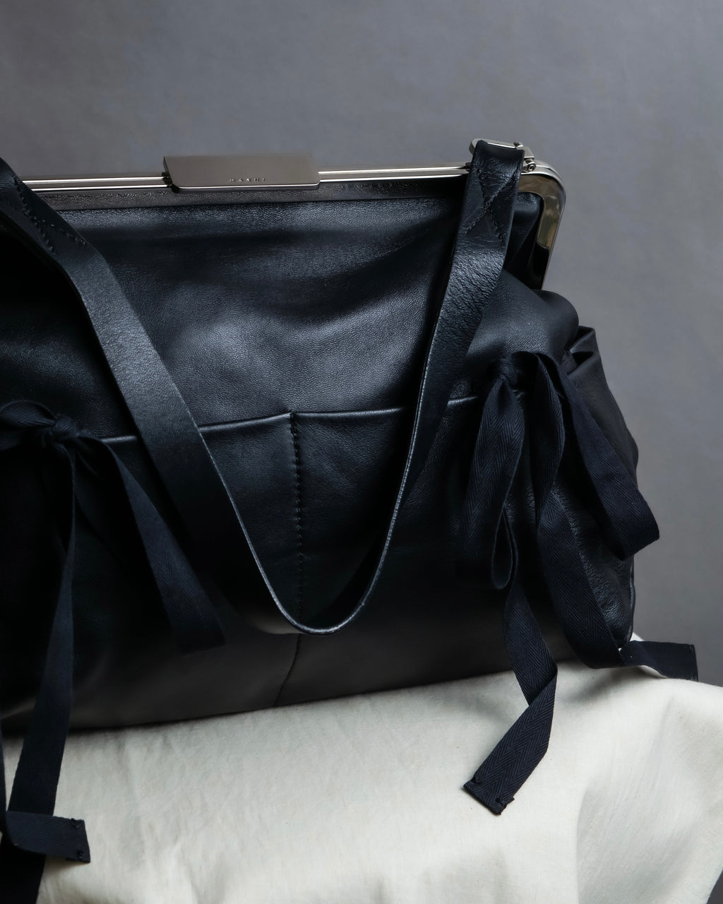 "MARNI" Side ribbon design rounded body leather bag
