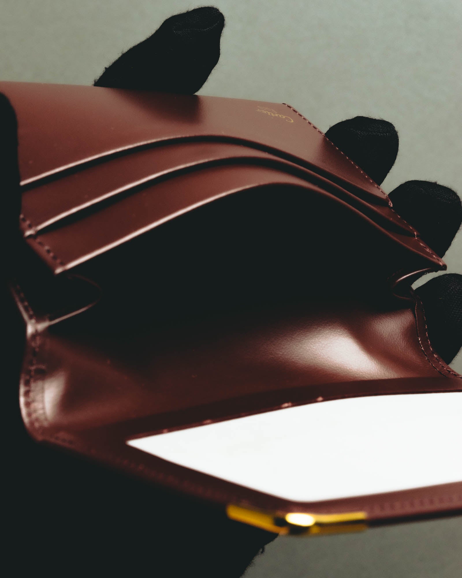 “Cartier” 90’s Must de Cartier burgundy embossed leather bifold wallet