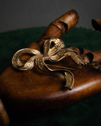 “Christian Dior“ 80’s-90’s CD-embossed ribbon brooch