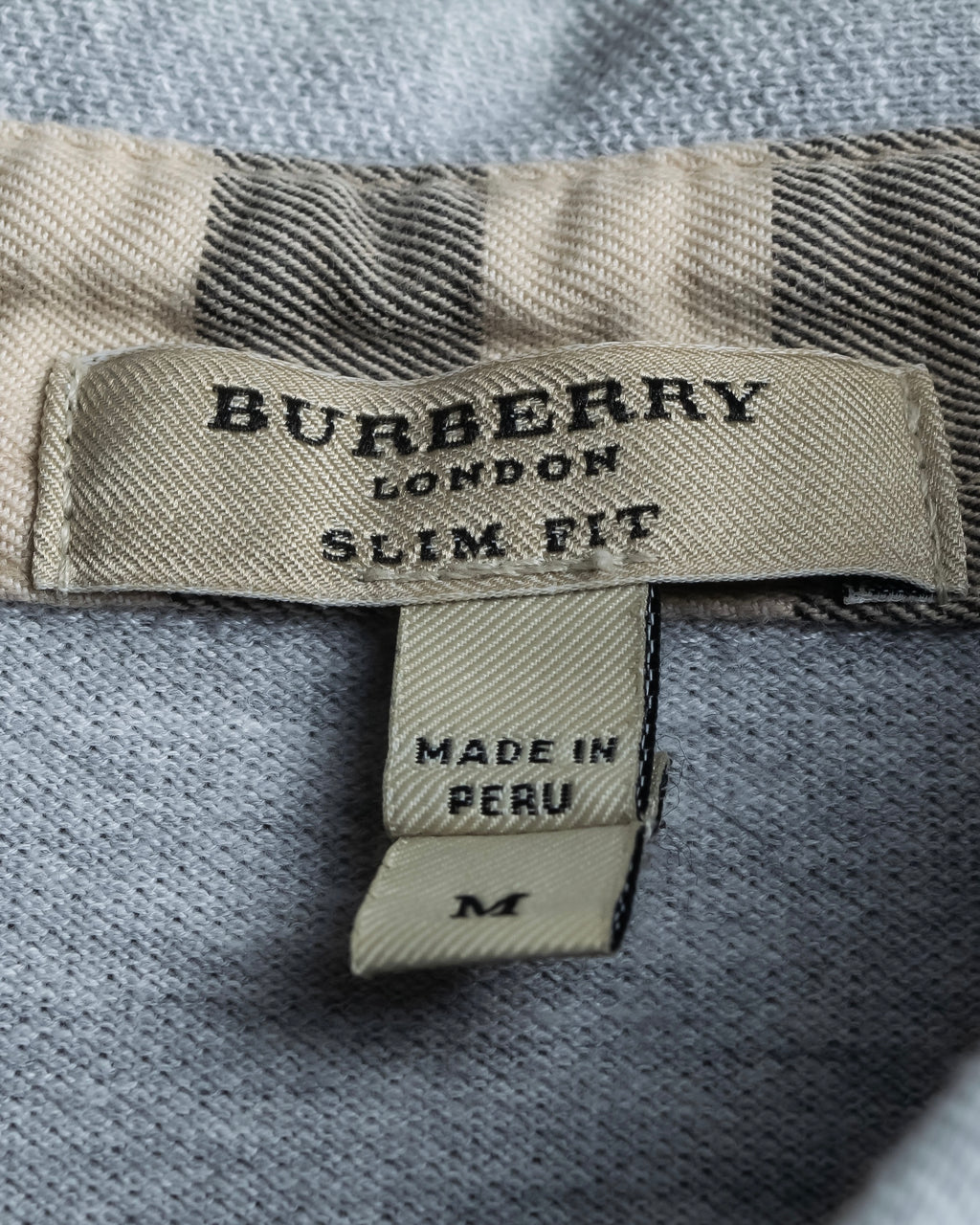 "BURBERRY" Knight logo engraved metal button polo shirt