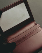 “Cartier” 90’s Must de Cartier burgundy embossed leather bifold wallet