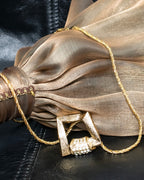 "YVES SAINT LAURENT" rhinestone motif gold necklace