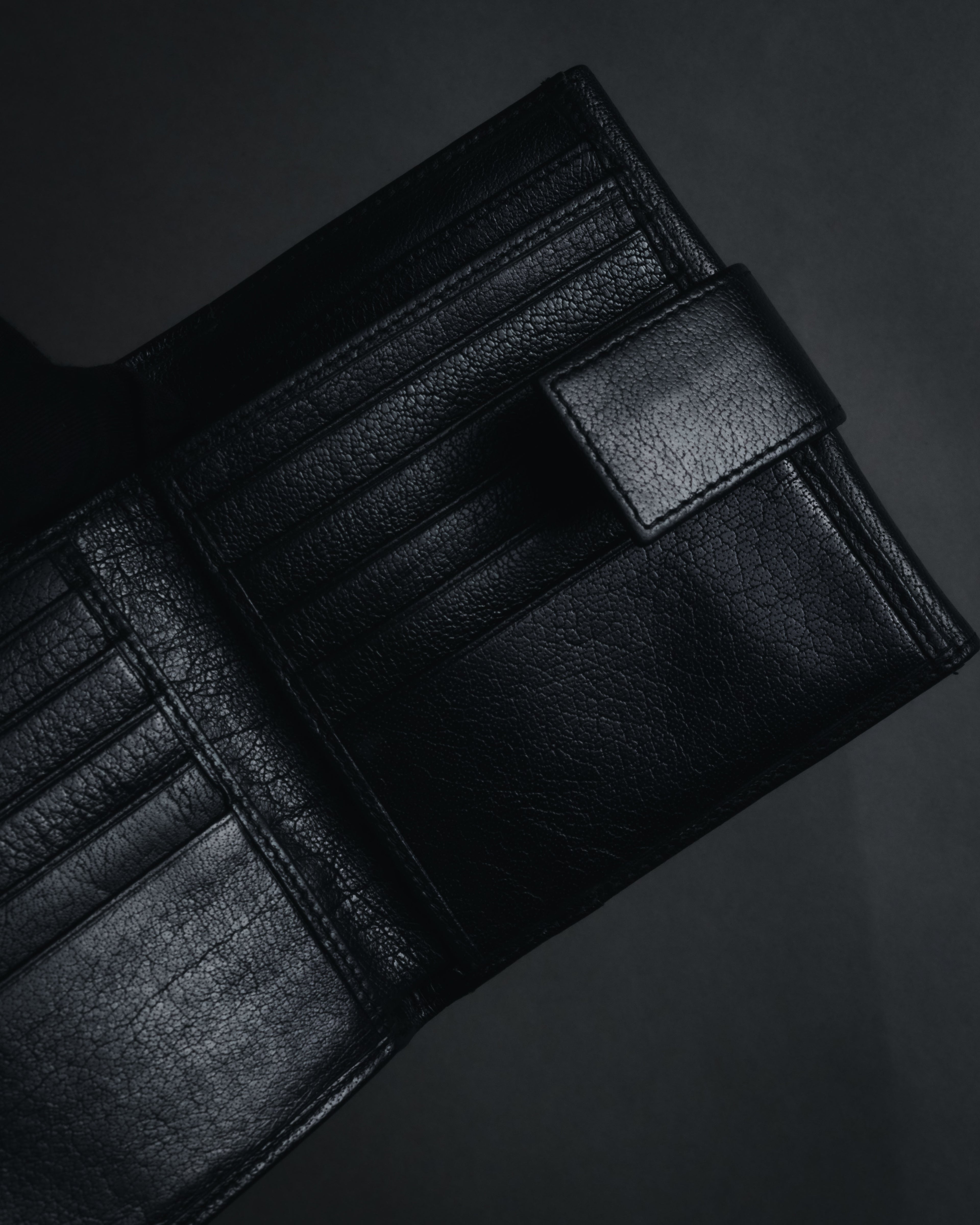 "YVES SAINT LAURENT" Stud-embellished monogram bi-fold wallet