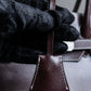 "HAMANO TOKYO" Trapezoidal shape iconic hardware leather one handle bag