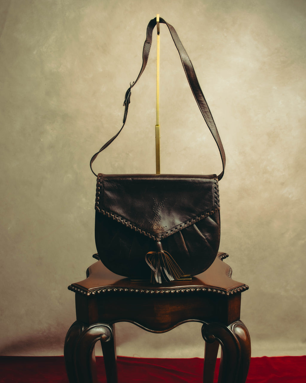 “Yves Saint Laurent” 70’s-80’s Perforated logo leather tassel shoulder bag