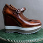 "PRADA" Brown leather stepped sole wedge heel pumps