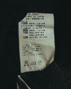 本体は毛100%、裾の別布は毛80%・ポリエステル10%・ナイロン10%の混紡と記載された品質表示タグ。MADE IN JAPANおよび品番HT-080210の表記も確認できる。