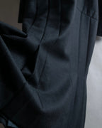 Tight-waisted wool shirt and black coat