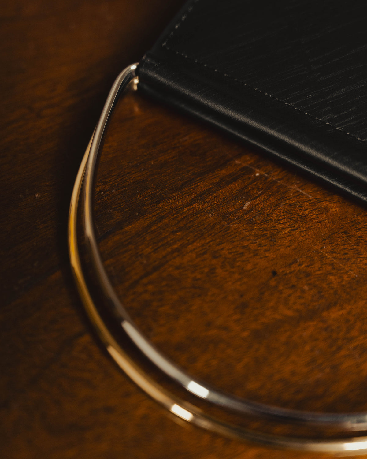 "Cartier" 80's Sculptural ring-handle leather wallet