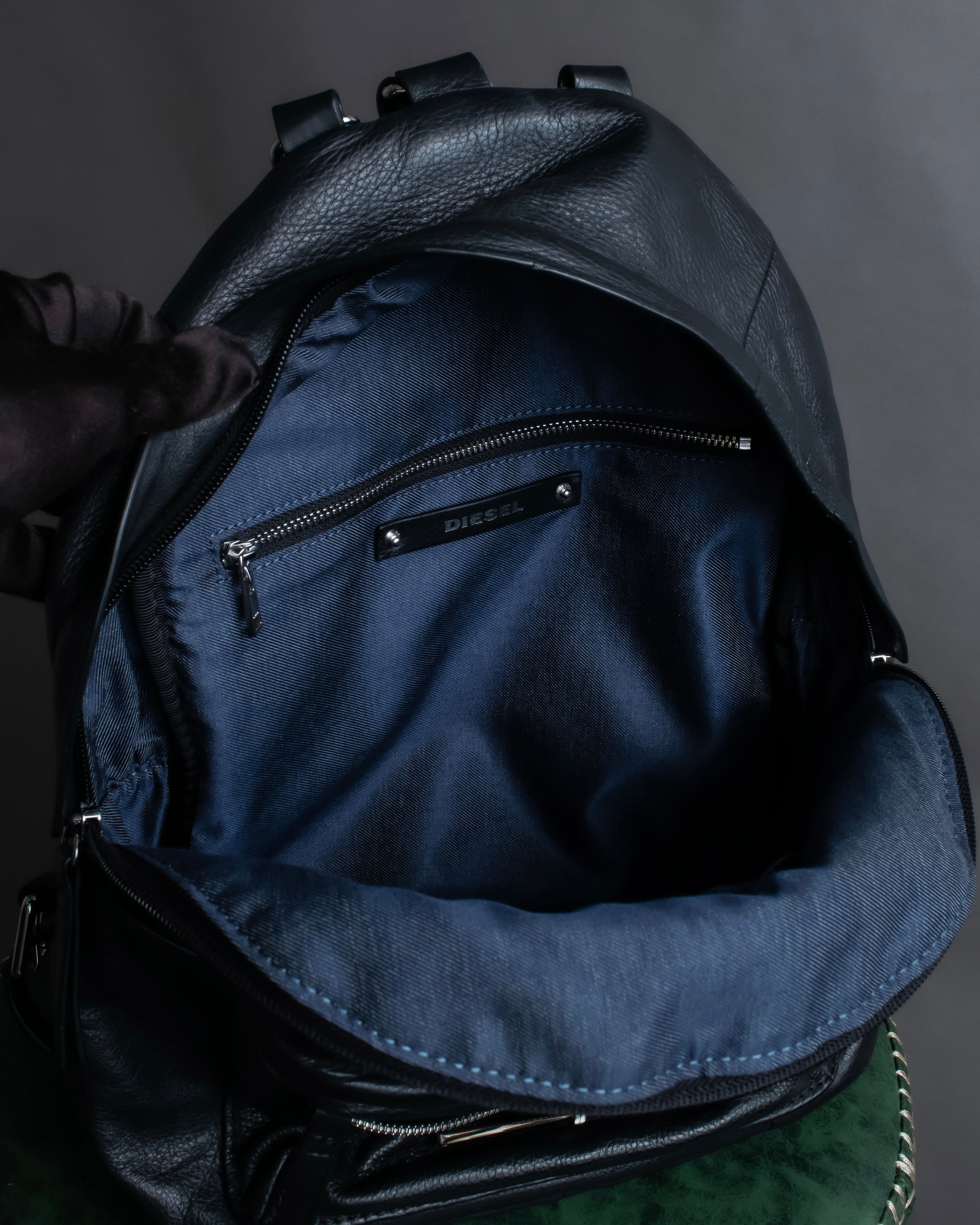 "DIESEL" Decorative zip design leather backpack