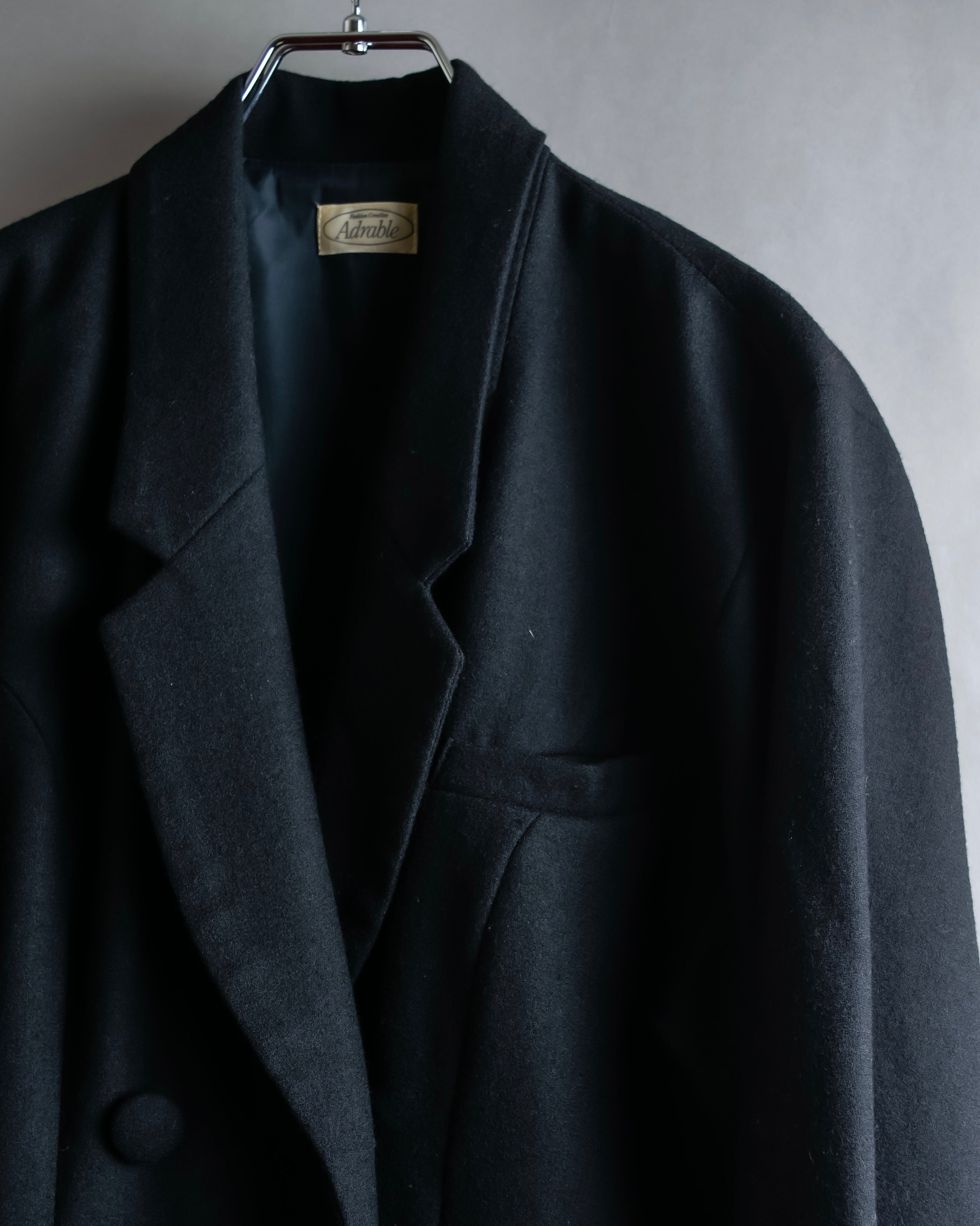 Tight-waisted wool shirt and black coat