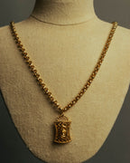 “NINA RICCI” Late 80’s-90’s gold tone openwork pendant necklace