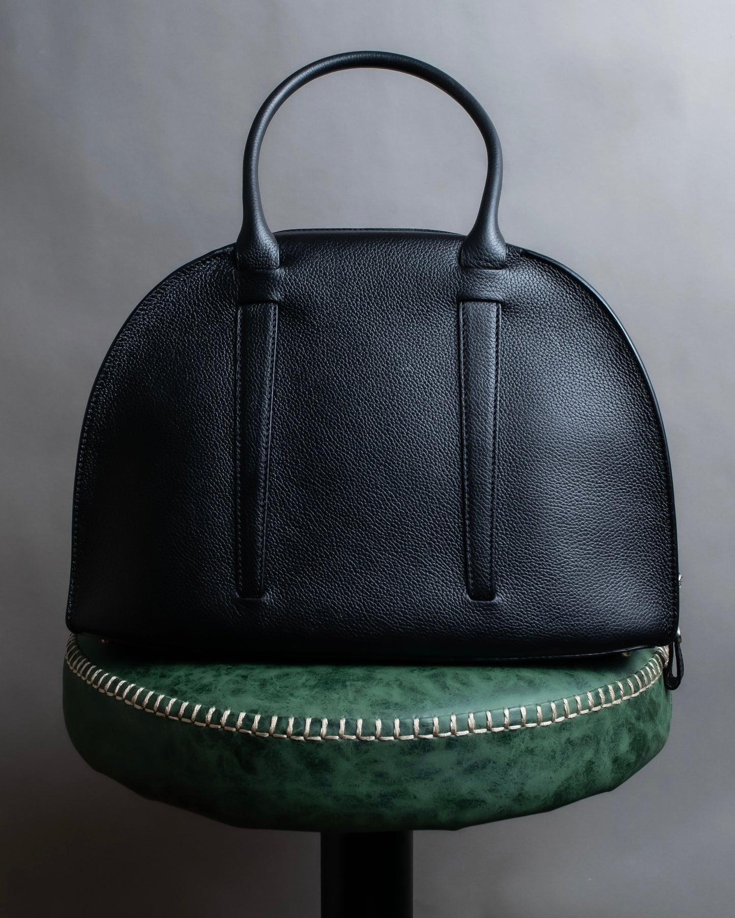 "MORABITO" Half moon design grained leather handbag