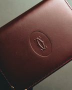 “Cartier” 90’s Must de Cartier burgundy embossed leather bifold wallet