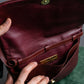 "Cartier" Texture changing bordeaux colored leather shoulder bag