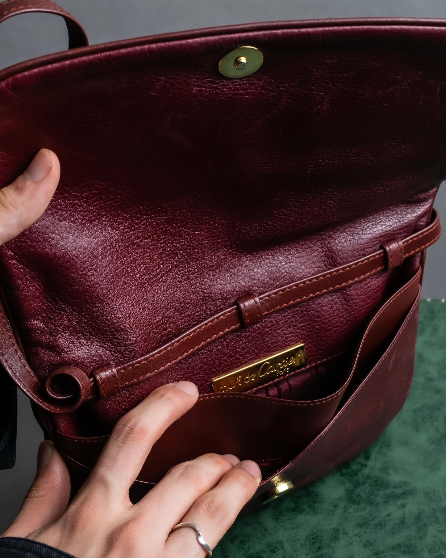 "Cartier" Texture changing bordeaux colored leather shoulder bag