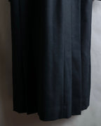 Tight-waisted wool shirt and black coat