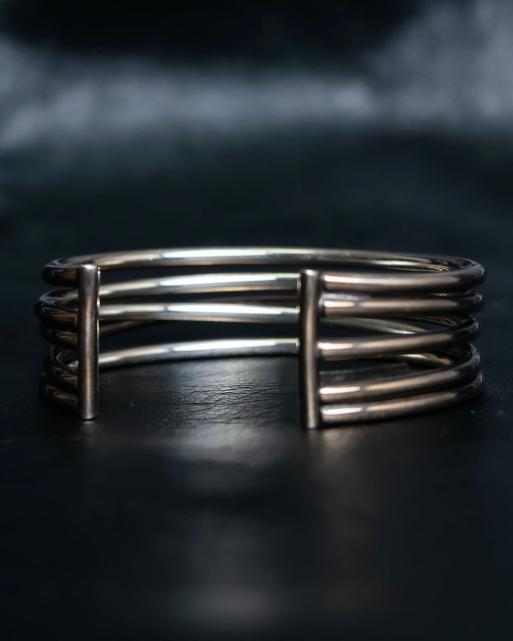 “PHILIPPE AUDIBERT” Crossed 5 line silver bangle