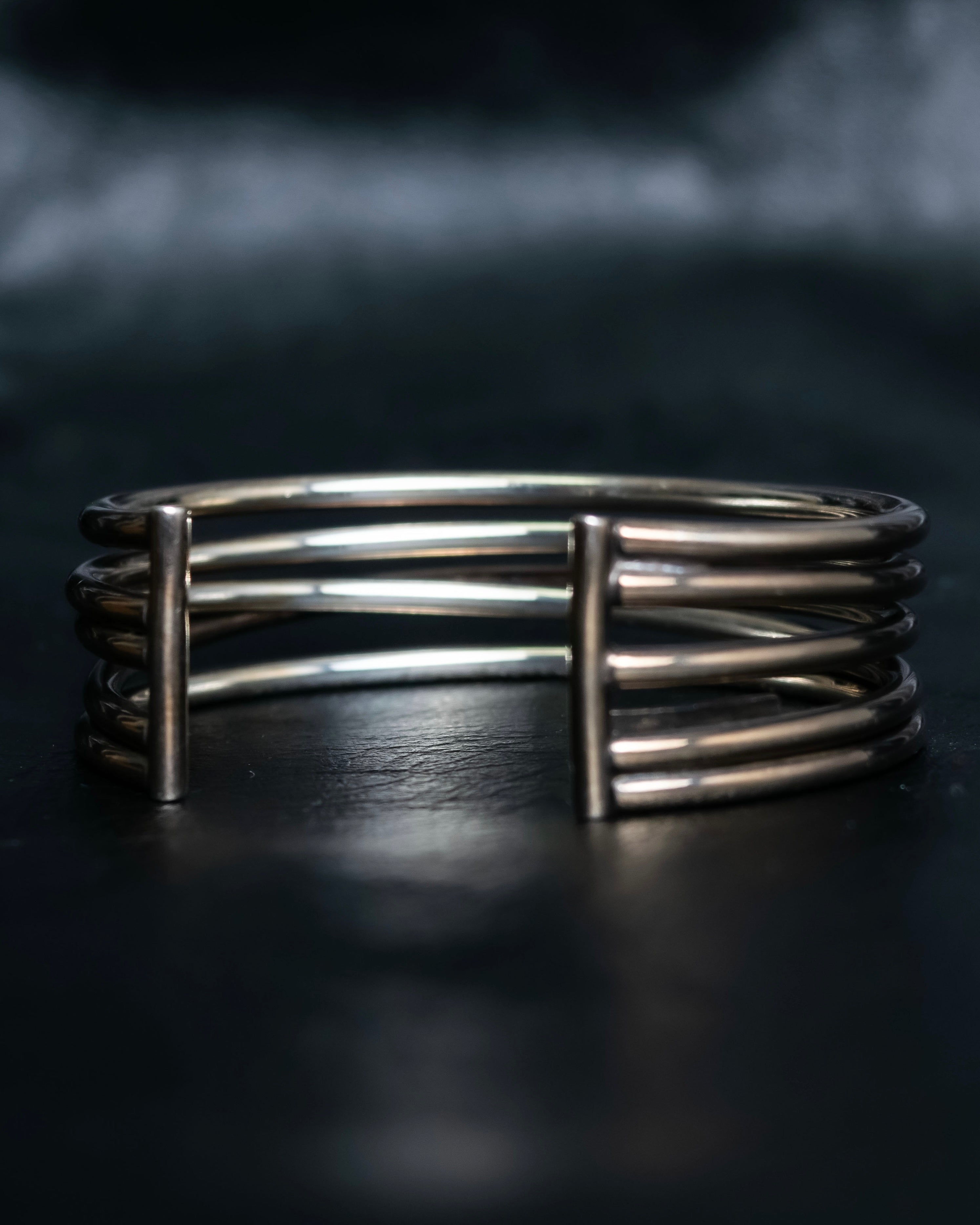 “PHILIPPE AUDIBERT” Crossed 5 line silver bangle