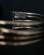 “PHILIPPE AUDIBERT” Crossed 5 line silver bangle