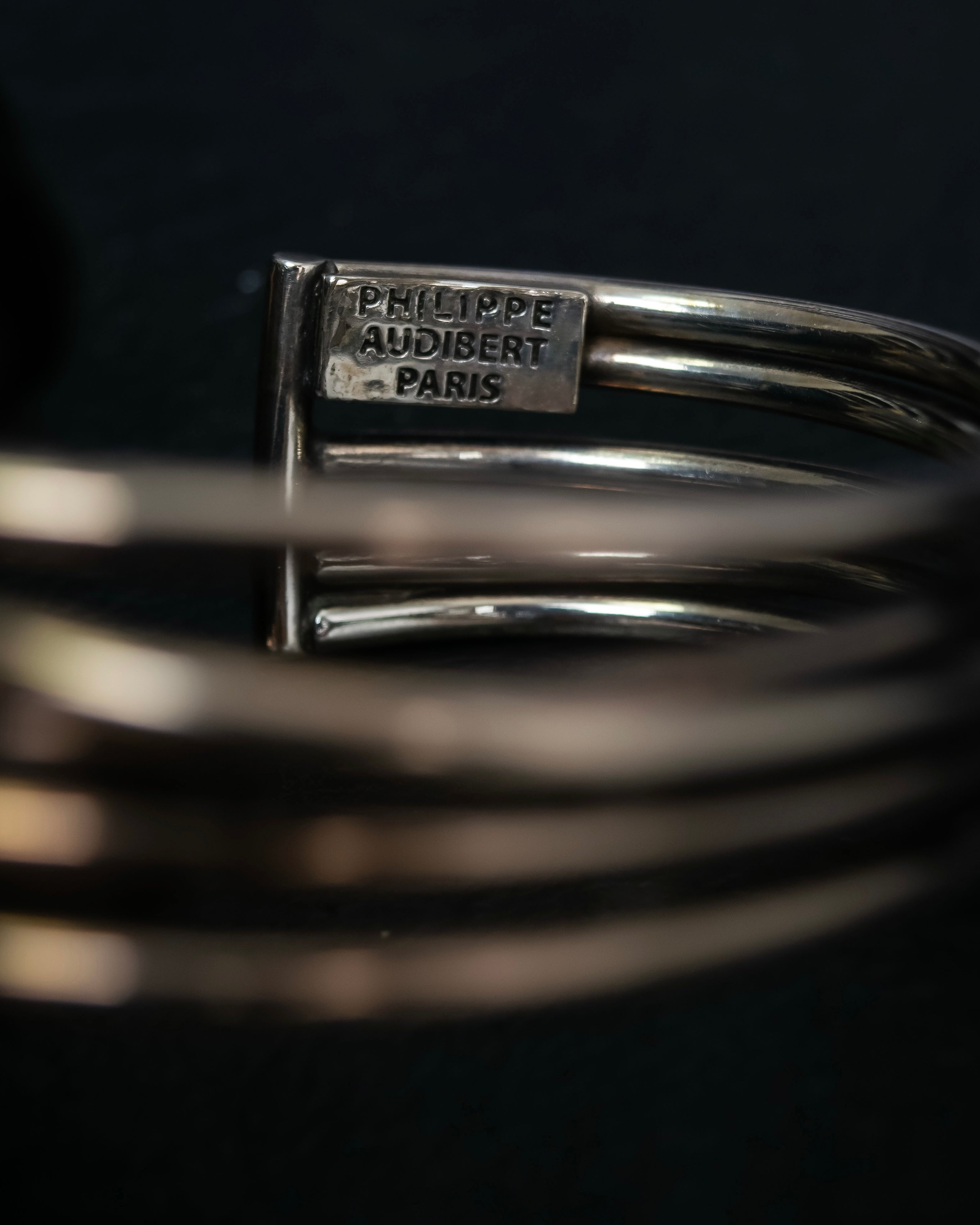 “PHILIPPE AUDIBERT” Crossed 5 line silver bangle