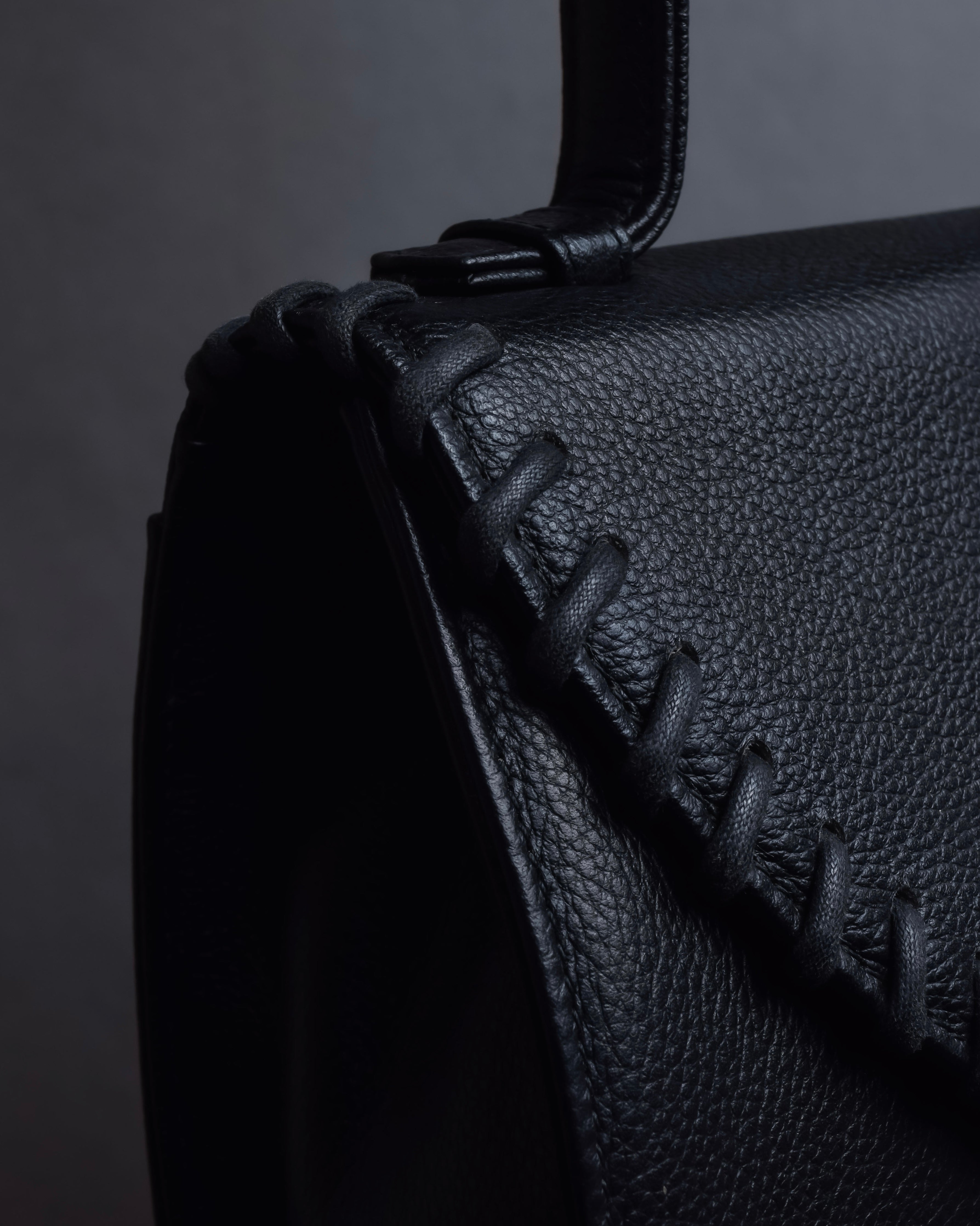 "YVES SAINT LAURENT" Hand stitched design trapezoid leather bag