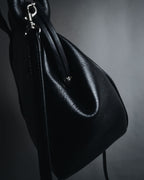 "Y’s" 22AW sculptural kiss-lock leather bag