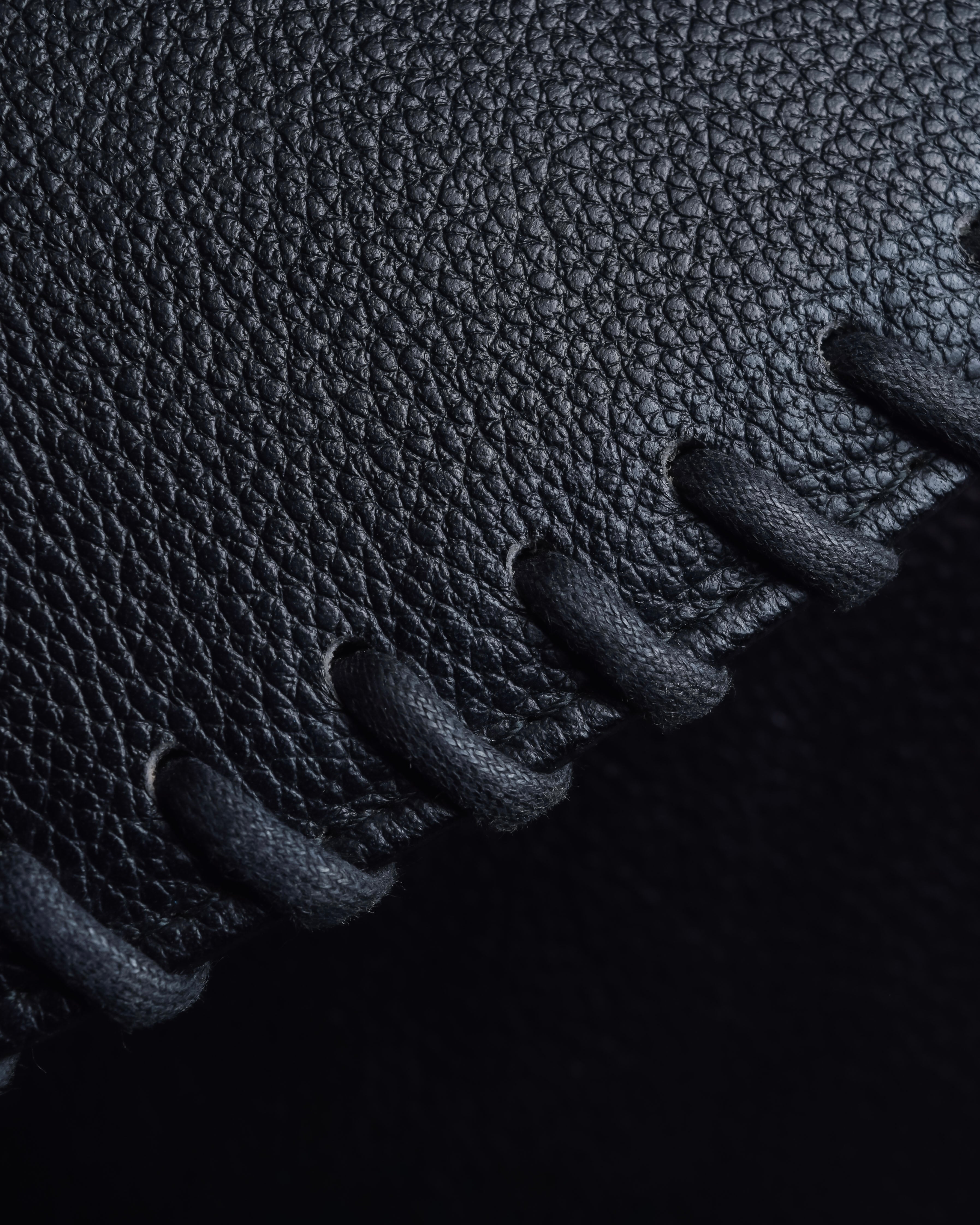 "YVES SAINT LAURENT" Hand stitched design trapezoid leather bag