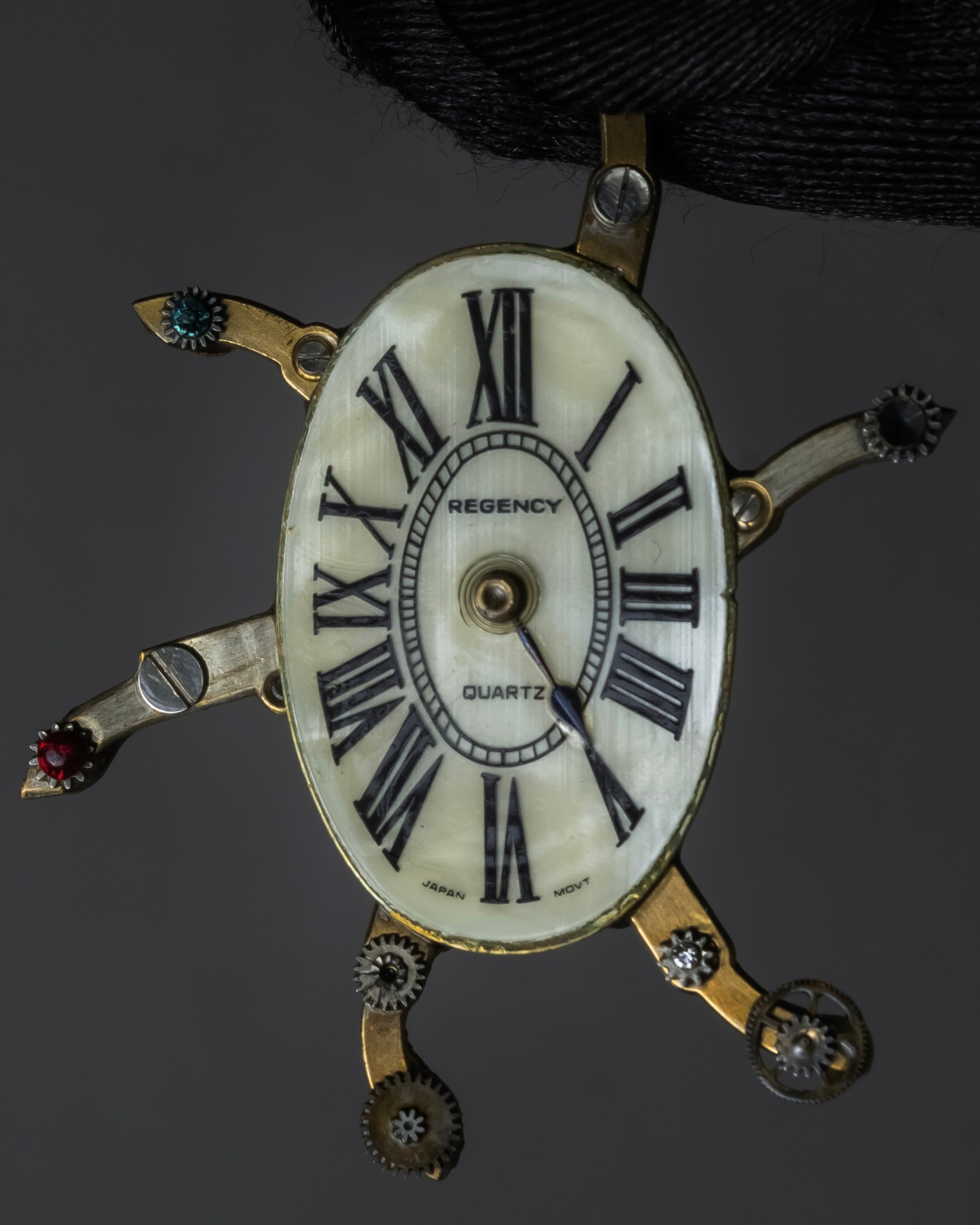 "Jerry Robertson design clock motif brooch"