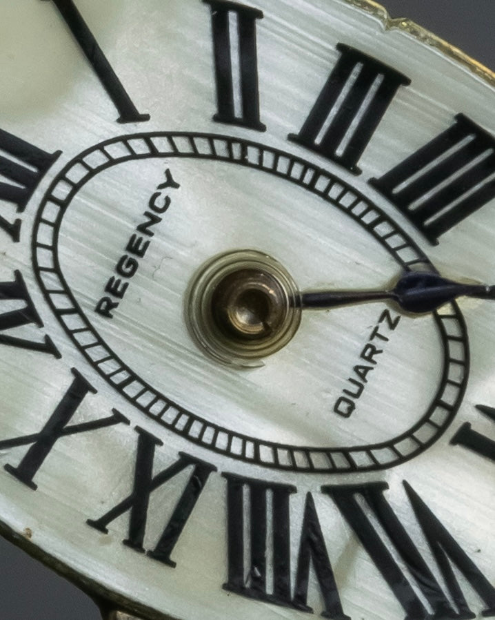 "Jerry Robertson design clock motif brooch"