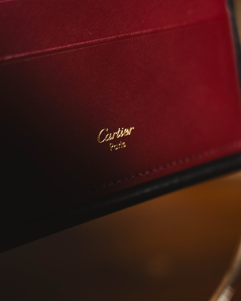 "Cartier" 80's Sculptural ring-handle leather wallet