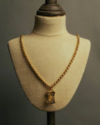 “NINA RICCI” Late 80’s-90’s gold tone openwork pendant necklace