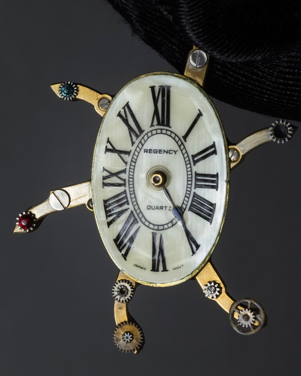 "Jerry Robertson design clock motif brooch"