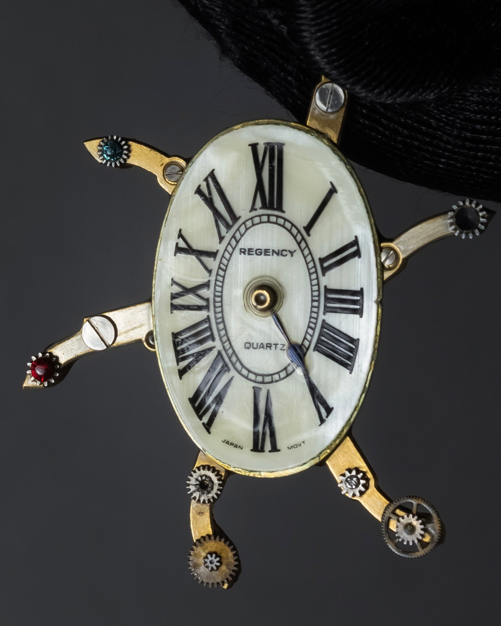 "Jerry Robertson design clock motif brooch"