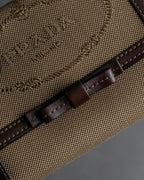 "PRADA" Logo engraved canvas＆leather combination short wallet