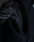 "JOHN LAWRENCE SULLIVAN"
 Large lapel double-breasted mid length coat