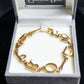 "Christian Dior" DIOR＆PARIS motif gold bracelet