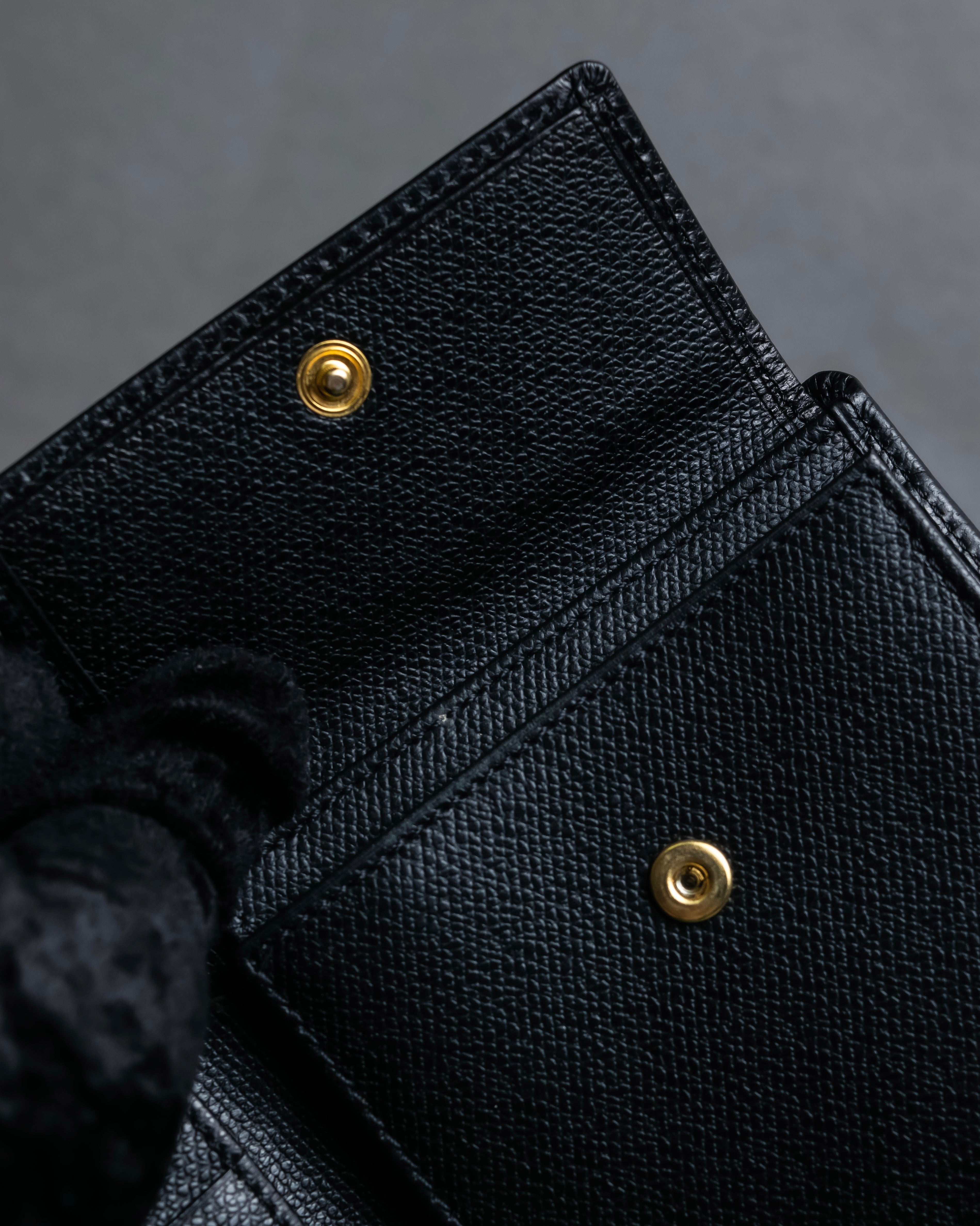 "YVES SAINT LAURENT" Cassandra logo engraved leather bi-fold wallet