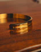 "Daniel Wellington" 20's Sleek gold cuff bracelet