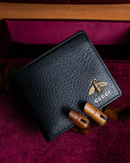 "GUCCI" Gold bee motif animalier bi-fold leather wallet
