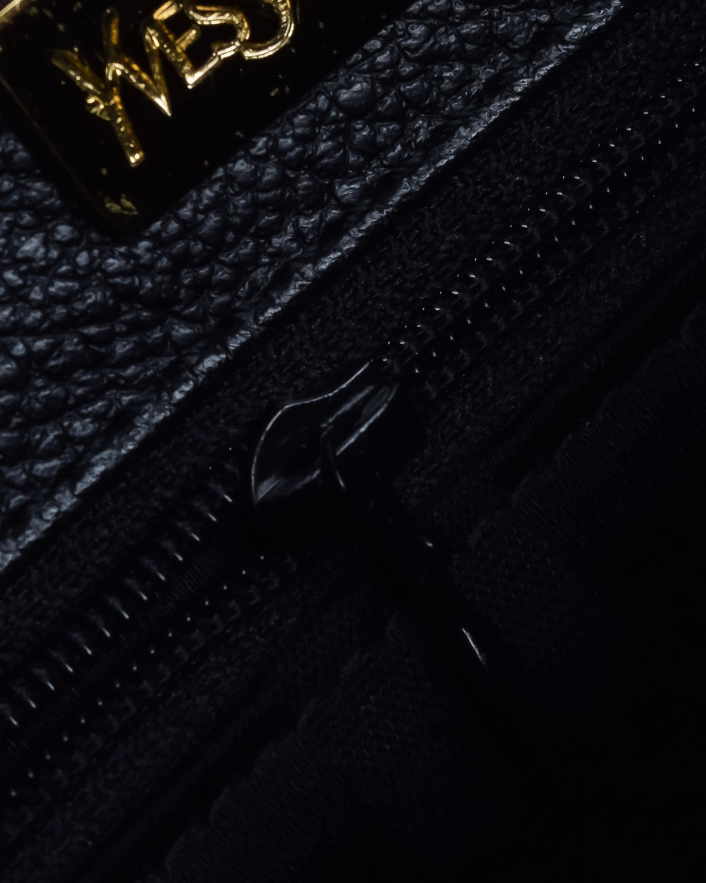 "YVES SAINT LAURENT" Hand stitched design trapezoid leather bag