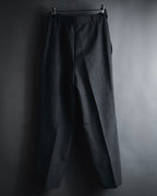 "CHANEL" high-waisted pleated trousers with signature gold button