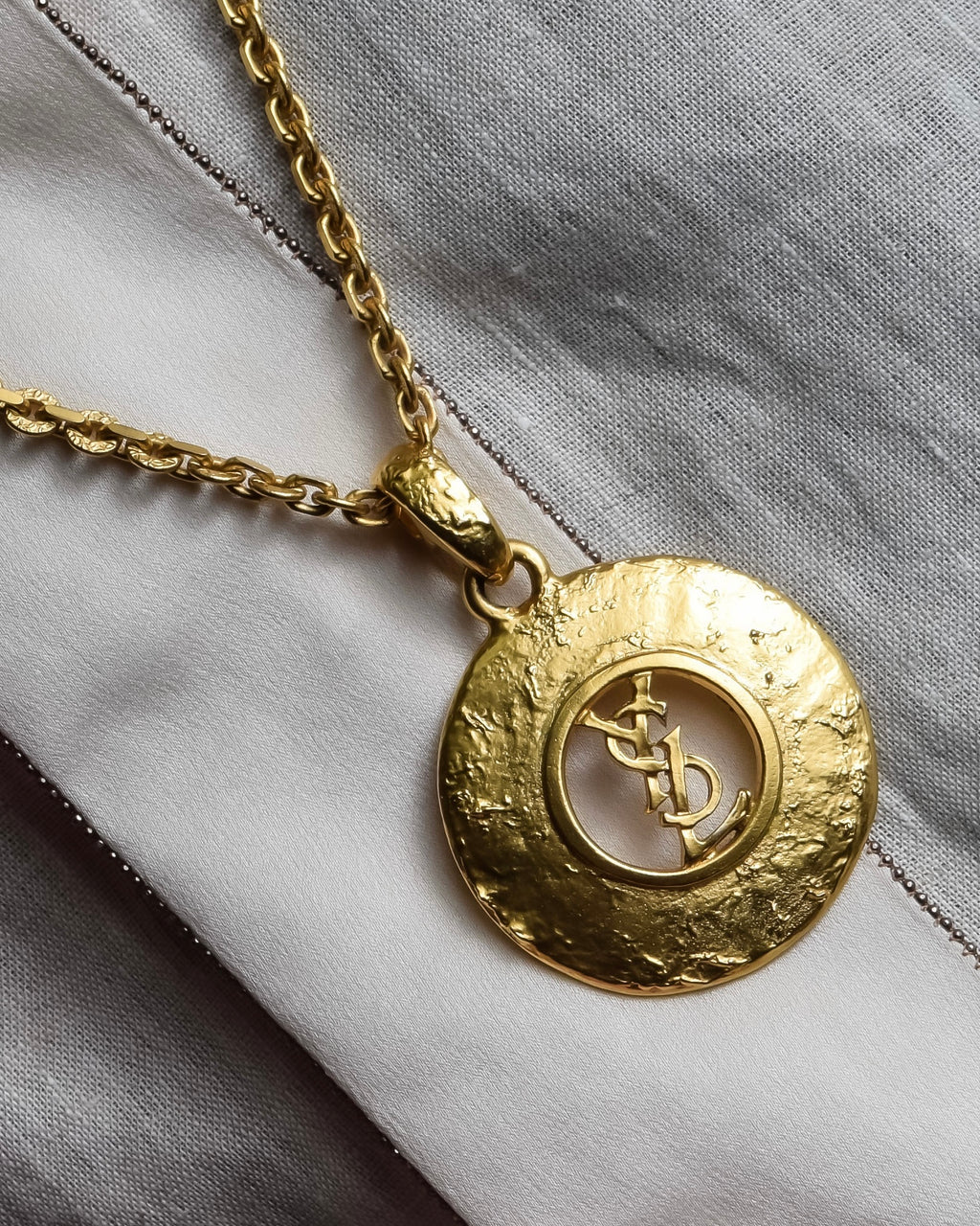 "YVES SAINT LAURENT" Embossed medallion YSL charm necklace